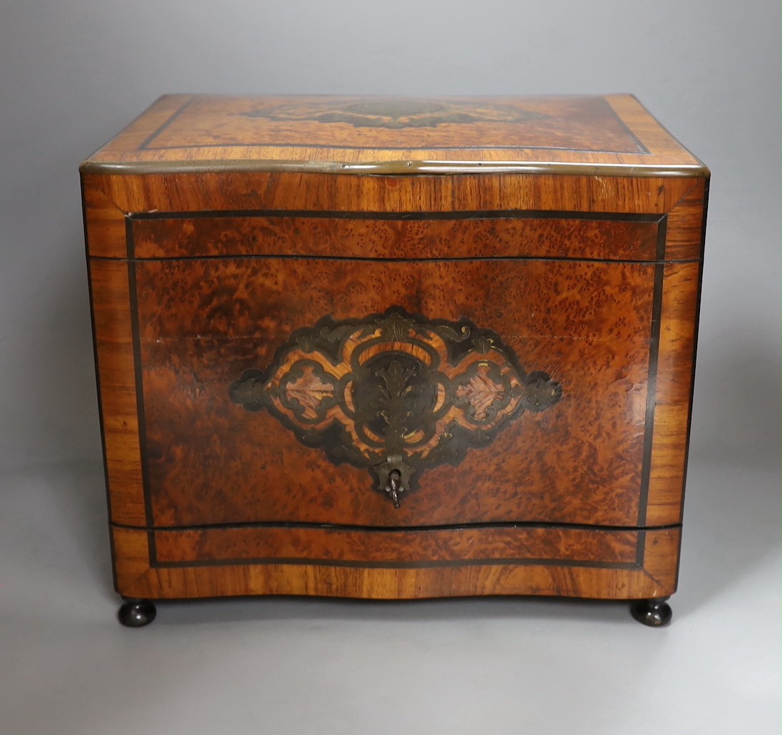 A 19th century French amboyna liqueur cabinet, 27cms high.